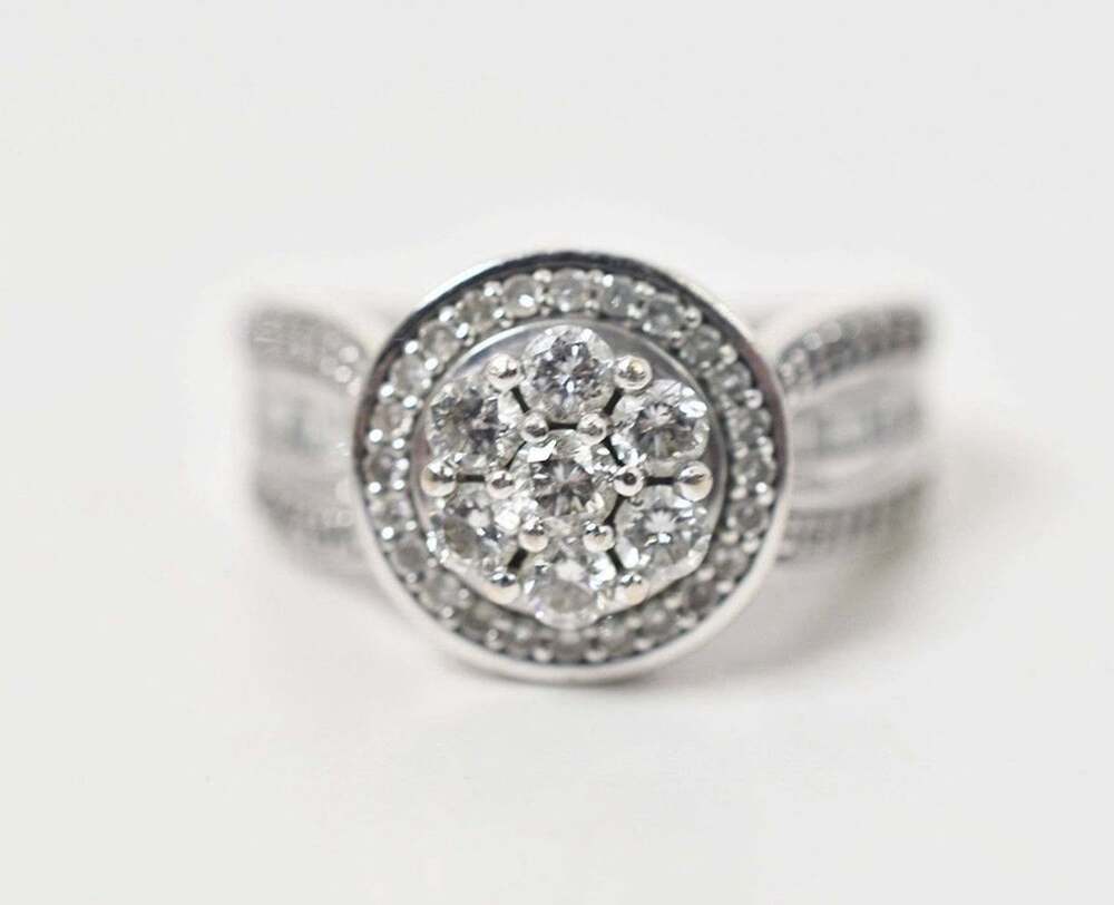 10K White Gold Diamond Ring. Displays 58 Diamonds. Size 7. 5.9 grams.
